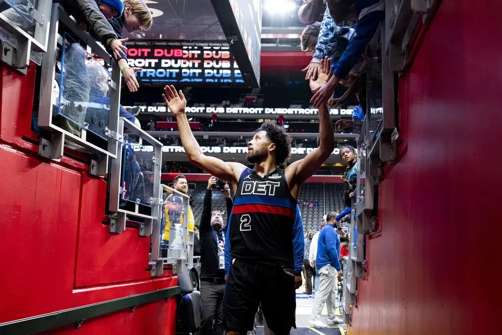 Detroit Pistons' guard, Cade Cunningham, greets fans