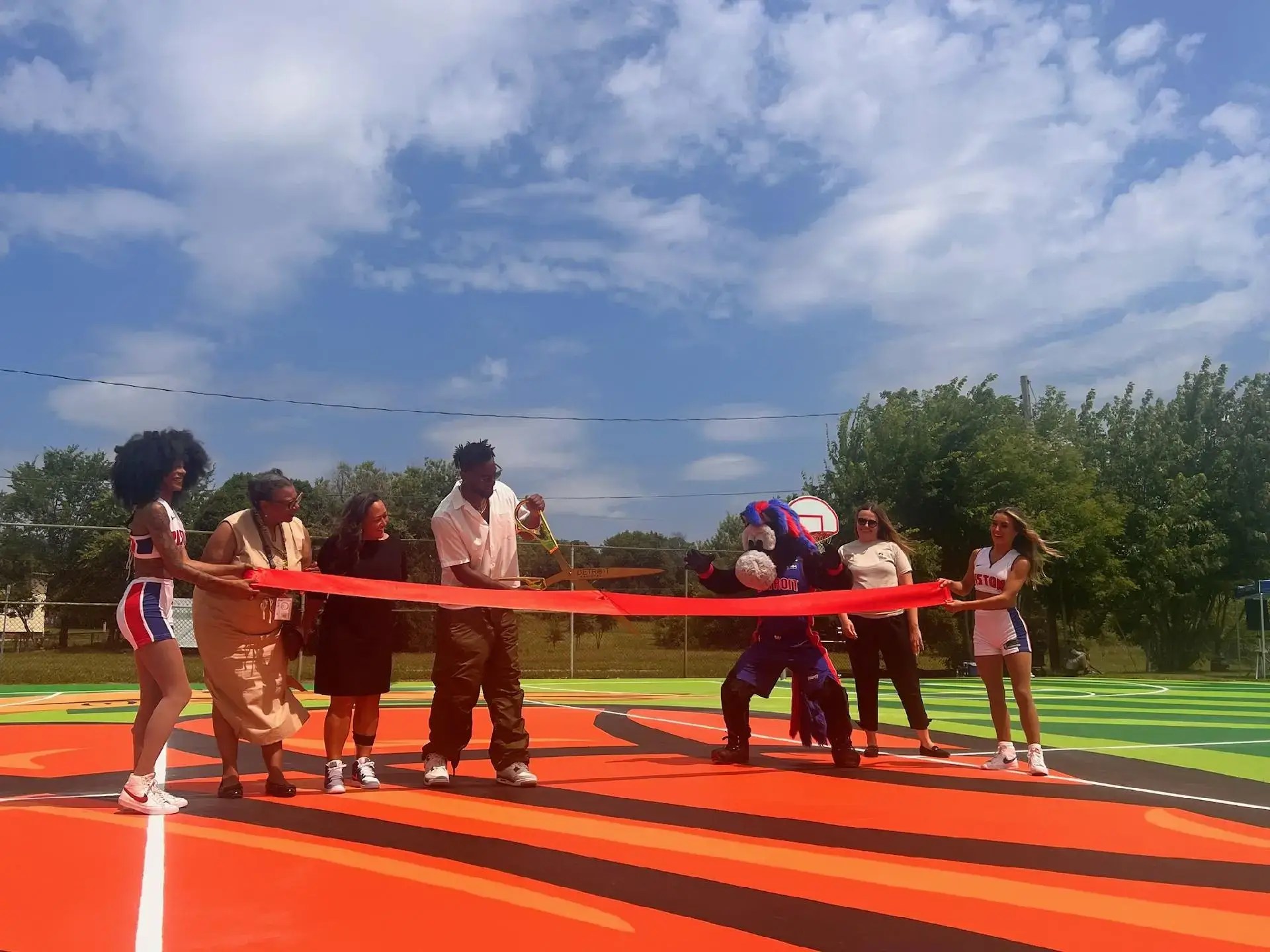 Ribbon-cutting ceremony on a basketball court