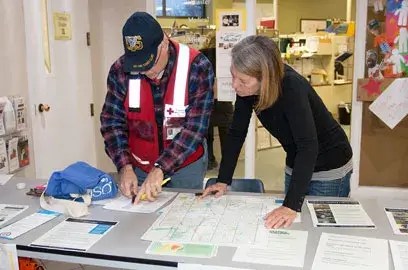 Americorps volunteers review plans