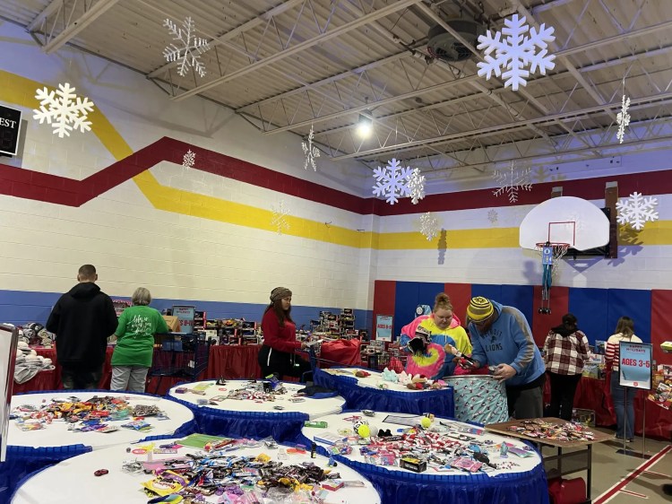 Volunteers sorting donated toys at the annual Salvation Army holiday gift drive.