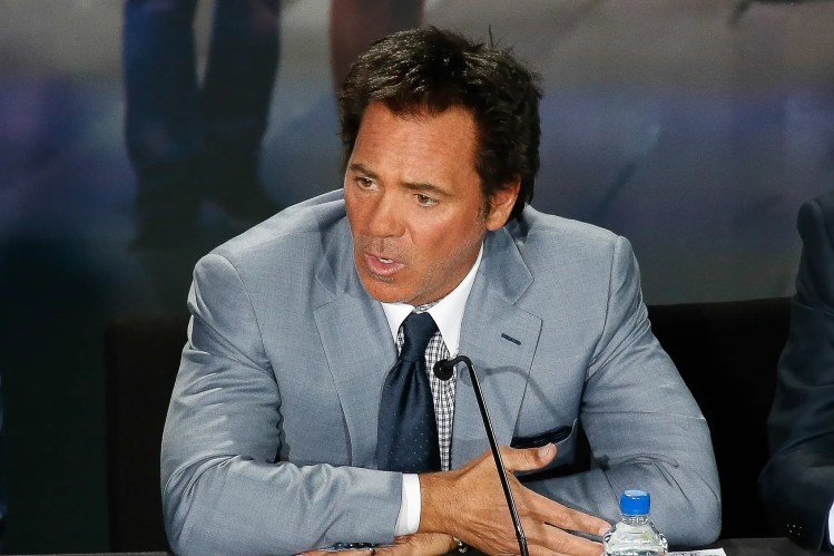 Tom Gores addresses members of the media