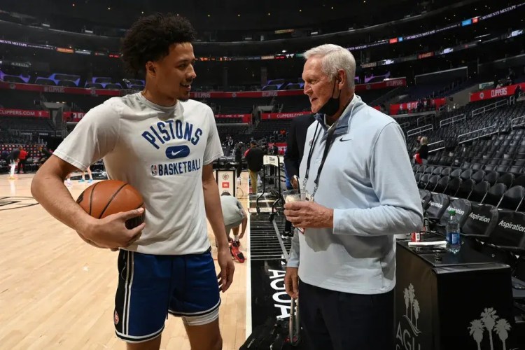 Legendary basketball player Jerry West interviews a player