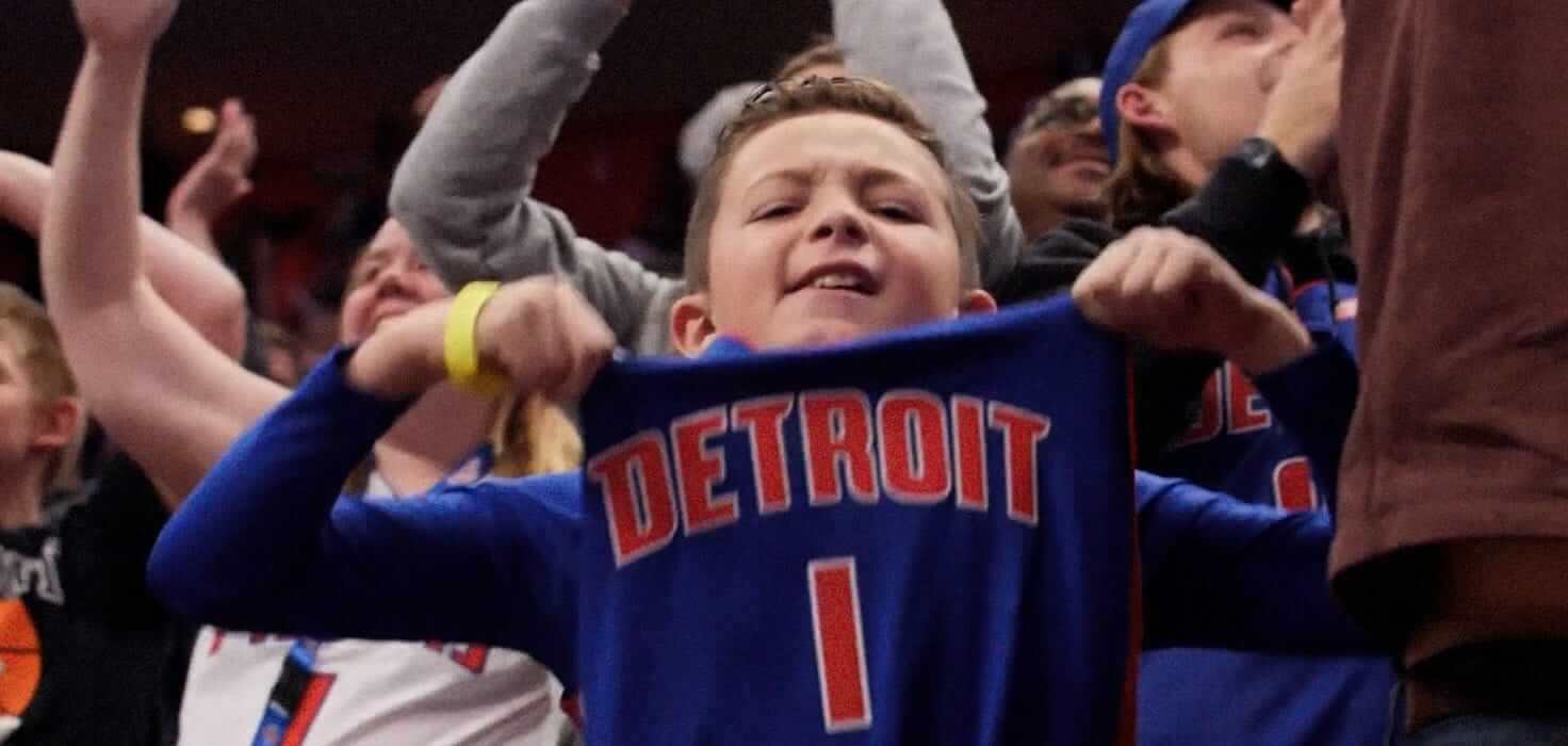 A young Detroit Pistons fan shows off his shirt
