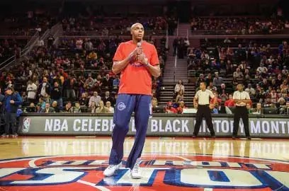 A Detroit Pistons player addresses the crowd in celebration of Black History Month