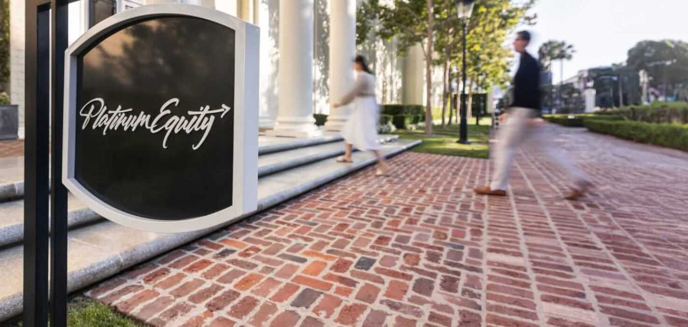 Georgian columns and brick walkway entrance of Platinum Equity