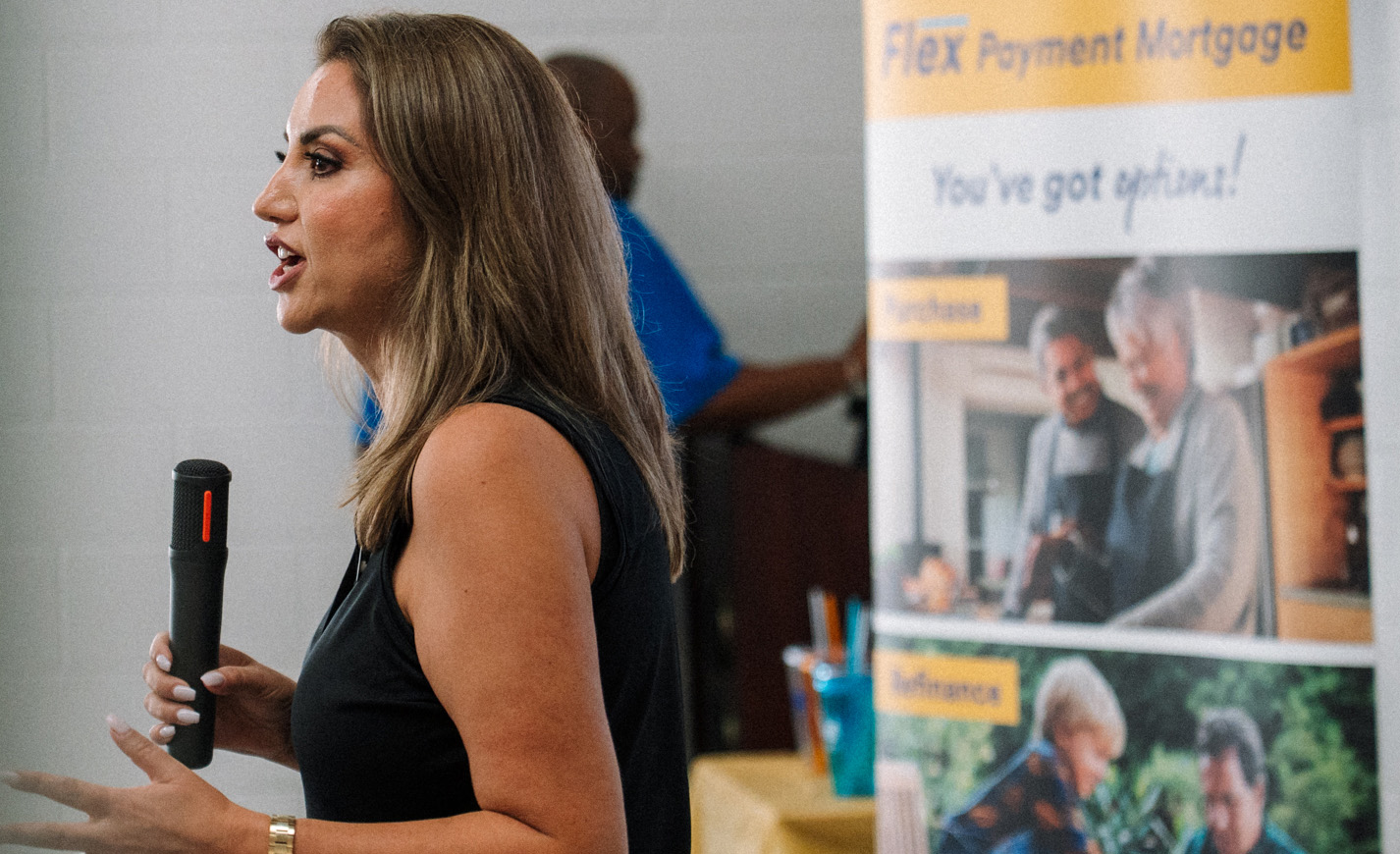 A woman speaking into a microphone