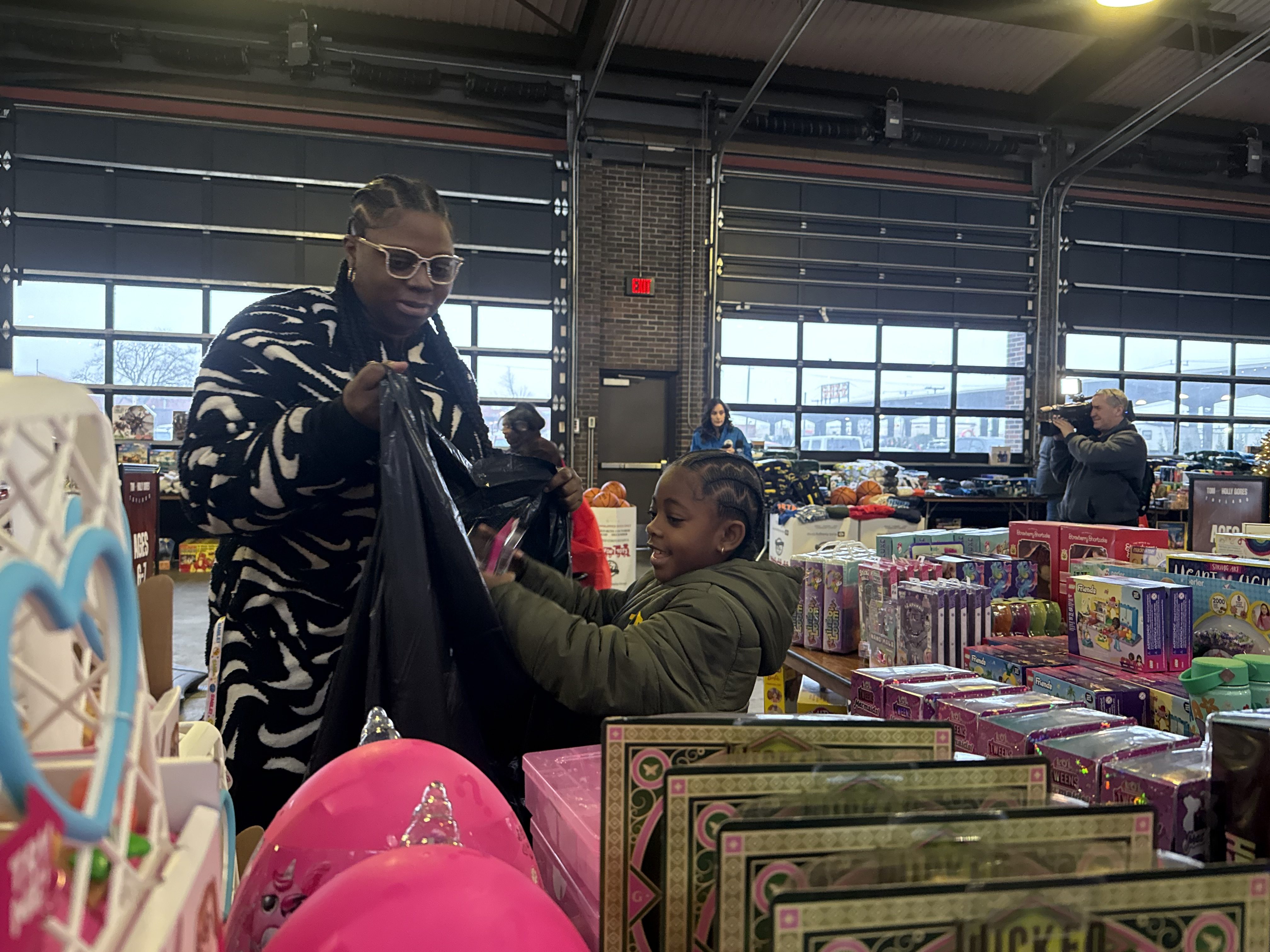 Platinum Equity Founder and CEO Tom Gores and his wife, Holly, annually partner with the Marine Corps Reserve Toys for Tots organization to donate toys and other gifts to the underserved community at Eastern Market in downtown Detroit.